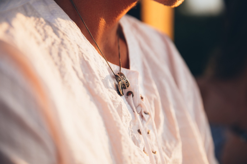 clothing, day, sitting, outdoors, jewel, close-up, outside, diamond - gemstone, outdoor, shoulders, metal, silver, platinum, pendant, ring, love, event