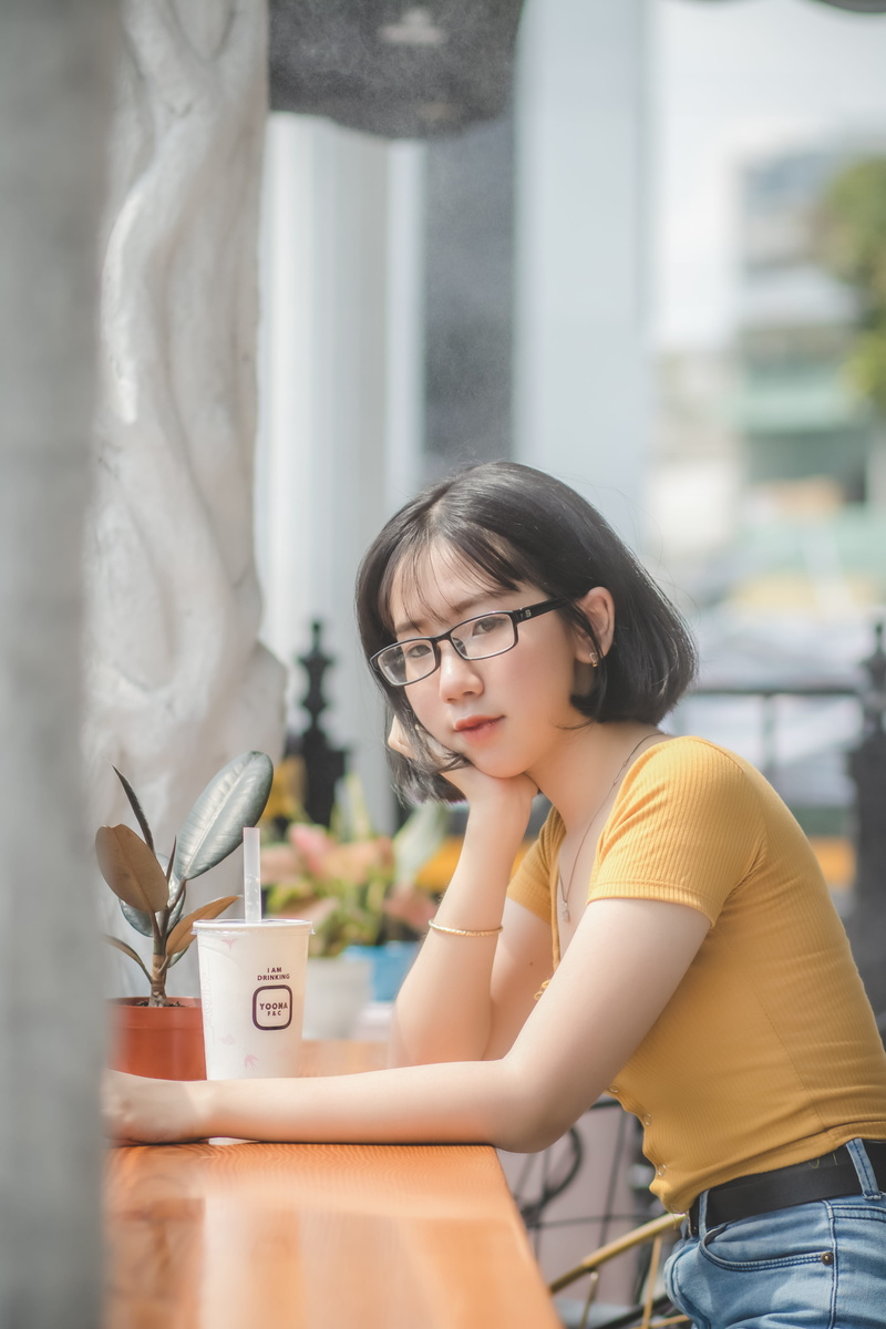 posing, young girl, plastic cup, [ot, female, wear, real people, facial expression, young woman, beautiful woman, portrait, leaning, head, glasses, casual clothing