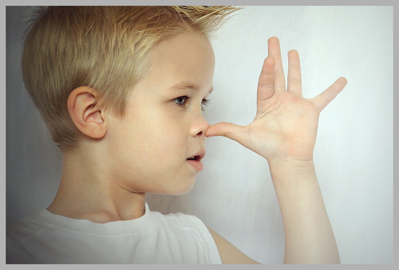 profile view, finger, one person, innocence, making a face, blond hair, indoors, human body part, looking, nose, cheeky, human face, portrait, child, males