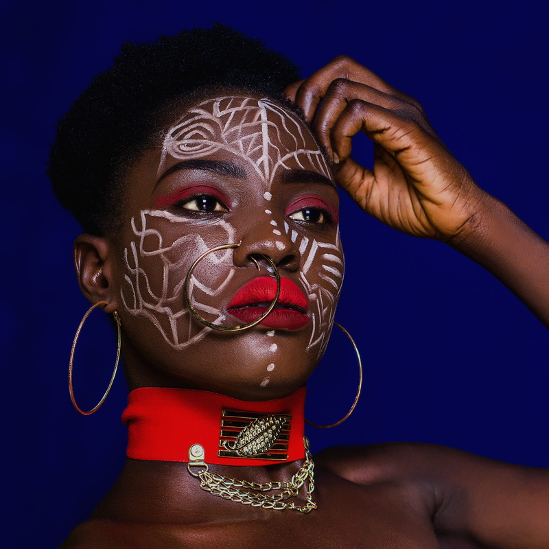 nose ring, jewelry, touching, portrait, hair, adult, black background, colored background, beautiful, indoors, nose, face paint, studio shot, creativity