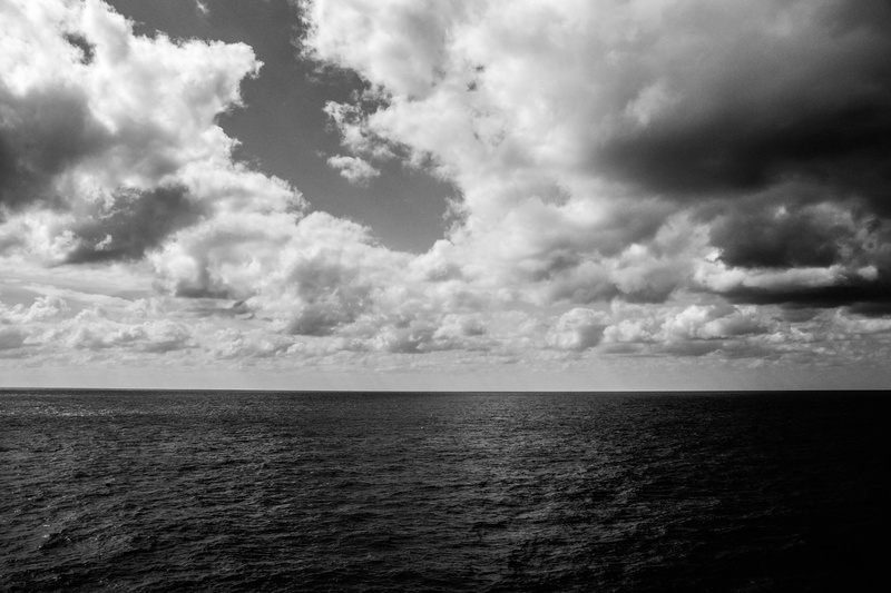 calm ocean, calm water, surreal, beauty in nature, calm sea, woman, freedom, black and white, 5K, beautiful girl, cloud - sky, sea, calm, horizon, water