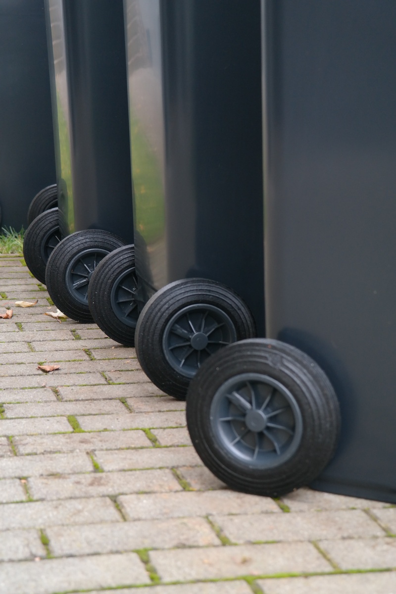 waste bins, mode of transportation, ton, outdoors, garbage can, tire, container, stationary, sunlight, black color, 5K, metal, close-up, mgb, day, land vehicle