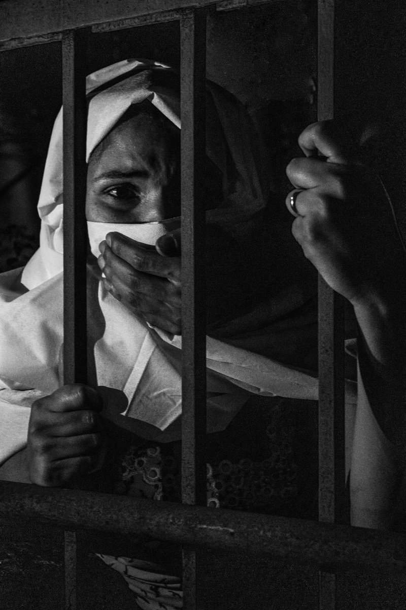 one person, punishment, front view, crime, hand, grayscale, adult, sadness, holding, sad, real people, indoors, heartbroken, visit, lifestyles, facial expression
