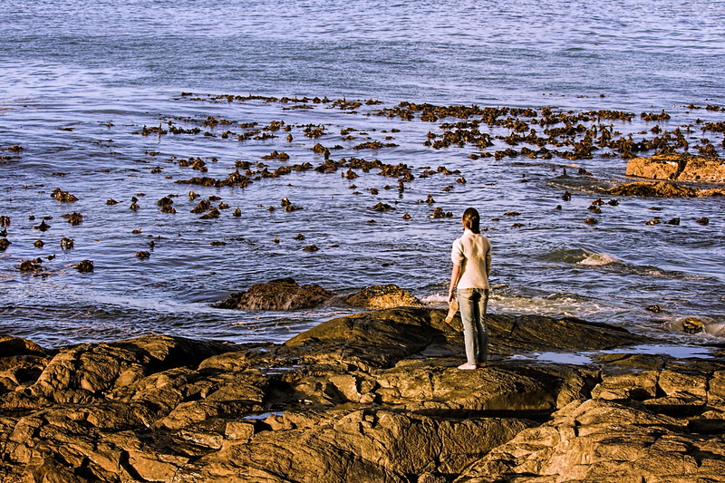 solitude, outdoors, full length, leisure activity, looking at view, beauty in nature, thinking, person, lost, rocks, nature, despair, alone, land, real people