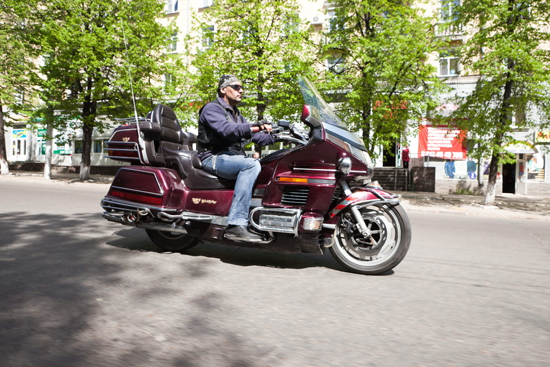 bike, outdoors, biker, people, real people, road, casual clothing, sport, riding, transportation, adult, speed, street, person, city, mode of transportation