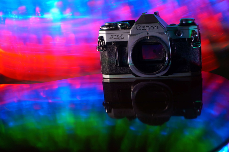 lens - optical instrument, lights, activity, camera, photography themes, illuminated, nightlife, ae 1, digital camera, photographing, indoors, photography equipment