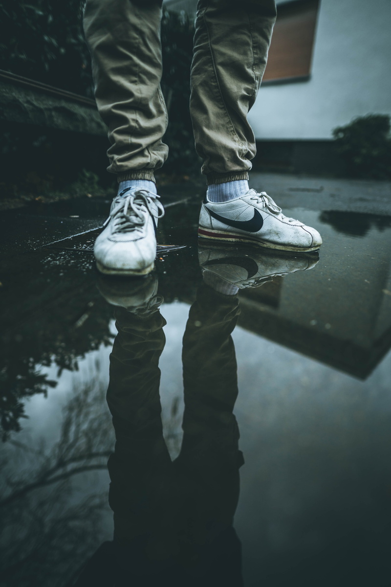 human leg, outdoors, sneaker, one person, nature, low section, clothing, puddle, ripple, 5K, shoe, person, human limb, reflection, machine, footwear, wet