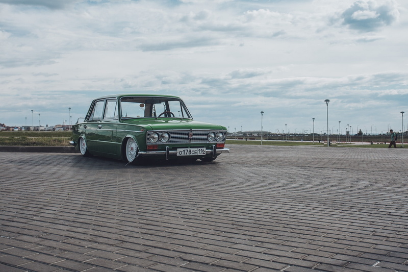 sedan, motor vehicle, architecture, city, 2103, mode of transportation, street, day, green, cloud - sky, built structure, no people, Lada, transportation