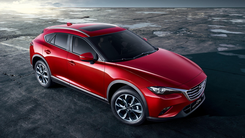 street, outdoors, stationary, motor vehicle, land vehicle, car, shiny, road, mode of transportation, avto, city, mazda, sign, luxury, red, transportation