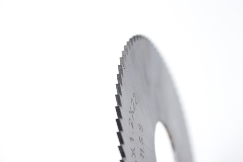 saw blade, focus on foreground, no people, cut out, single object, simplicity, selective focus, 5K, white background, business, communication, gear, serrated