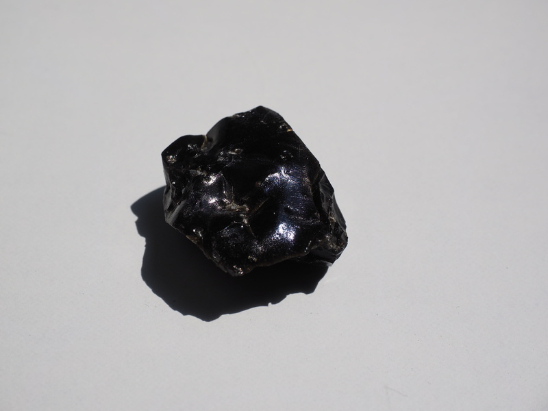 studio shot, mineral, black color, sweet food, stone, cut out, food and drink, high angle view, geology, fruit, healthy eating, single object, shiny, solid