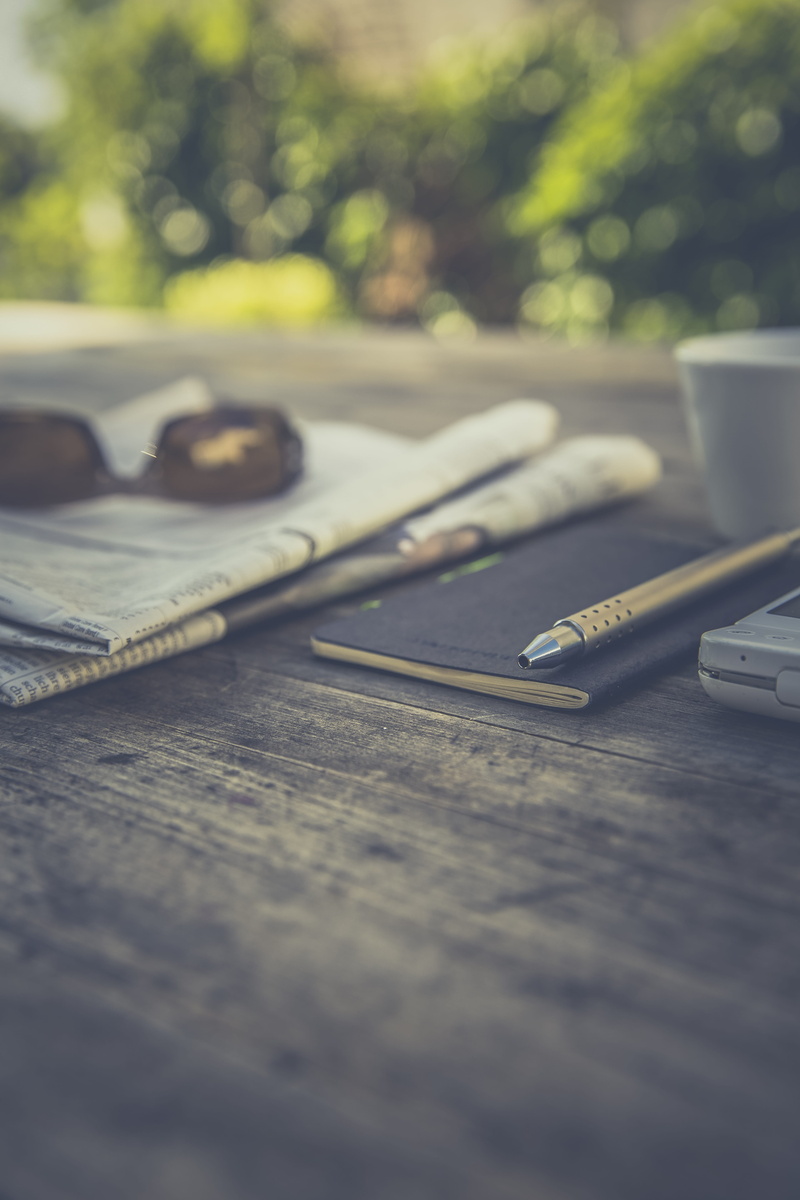 still, broadsheets, mobile, items, book, glasses, eyeglasses, personal accessory, planner, things, day, paper, journal, surface level, pen, selective focus