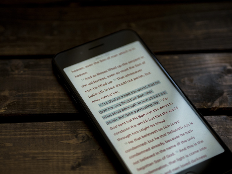 high angle view, text, bible, smartphone, highlight, no people, church, table, app, 4K, book, scripture, mobile phone, christian, open, publication, indoors