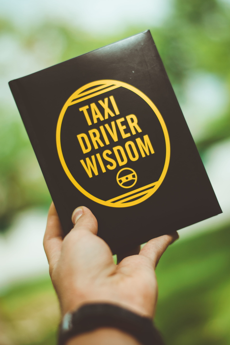 unrecognizable person, holding, book, sun, message, 5K, finger, information, day, lifestyles, tehran province, real people, quote, driver, outdoors, human hand