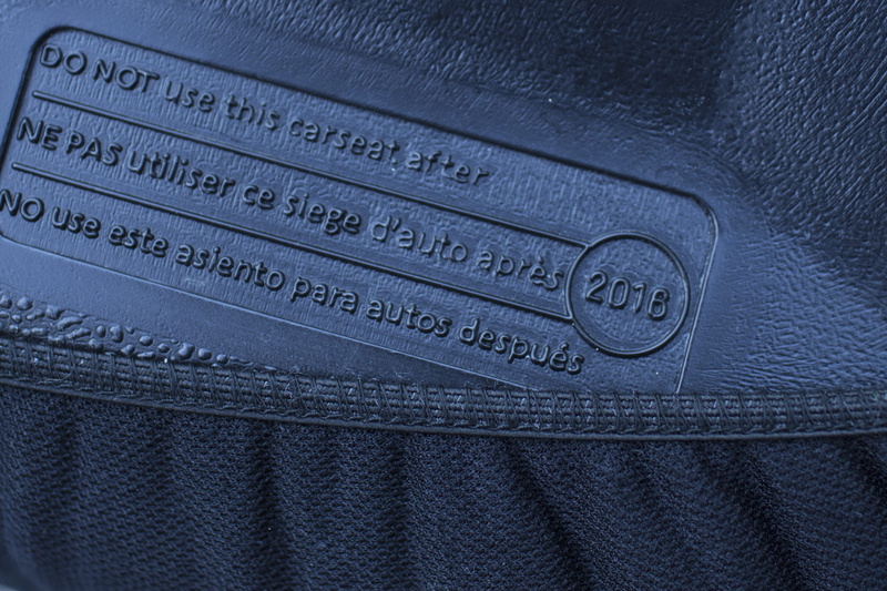luxury, car seat, western script, no people, communication, clothing, textured, wealth, extreme close-up, jeans, safety, number, booster seat, blue, indoors