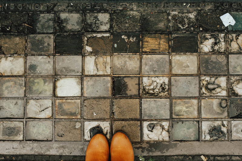 isle of wight, high angle view, united kingdom, paving stone, lifestyles, standing, shoes, tile, looking down, real people, footpath, personal perspective