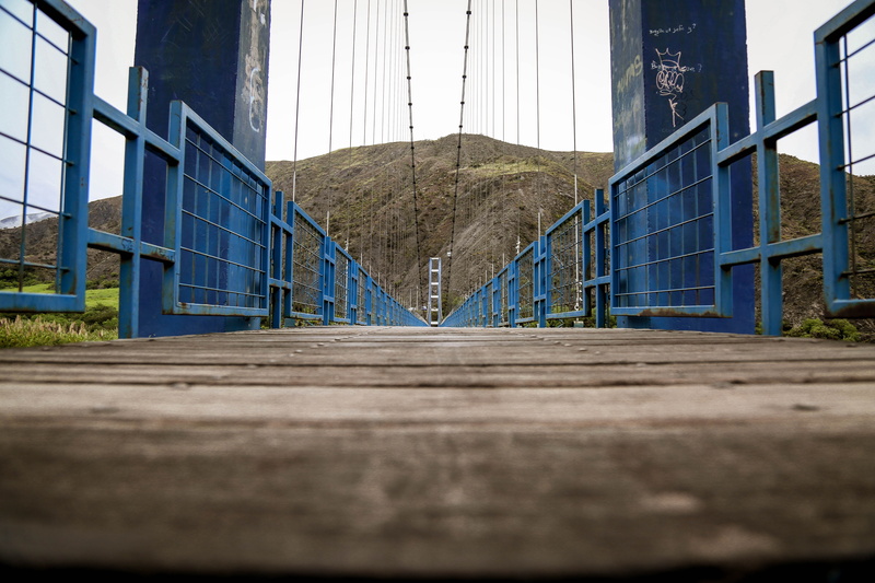 footpath, no people, window, sky, plant, railing, focus on background, ecuador, mountain, surface level, color, clear sky, 5K, tropical, built structure