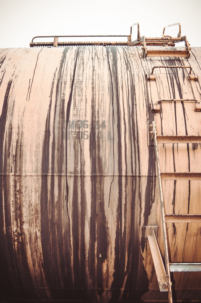 5K, minerals, oil, still life, no people, station, heavy, built structure, gasoline, outdoors, vehicle, railway track, wood - material, building exterior