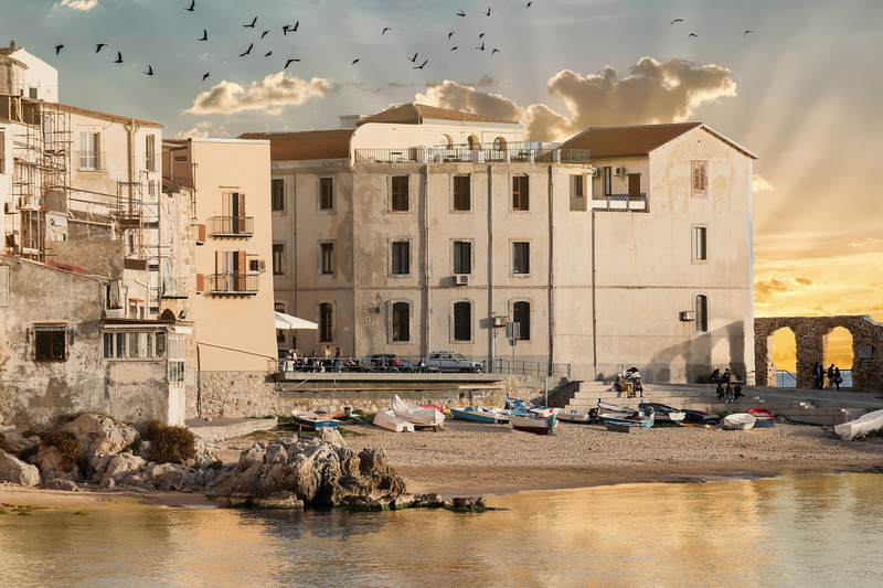 waters, large group of animals, borgo, flying, houses, animal wildlife, incidental people, seagull, built structure, cefalù, construction, building exterior