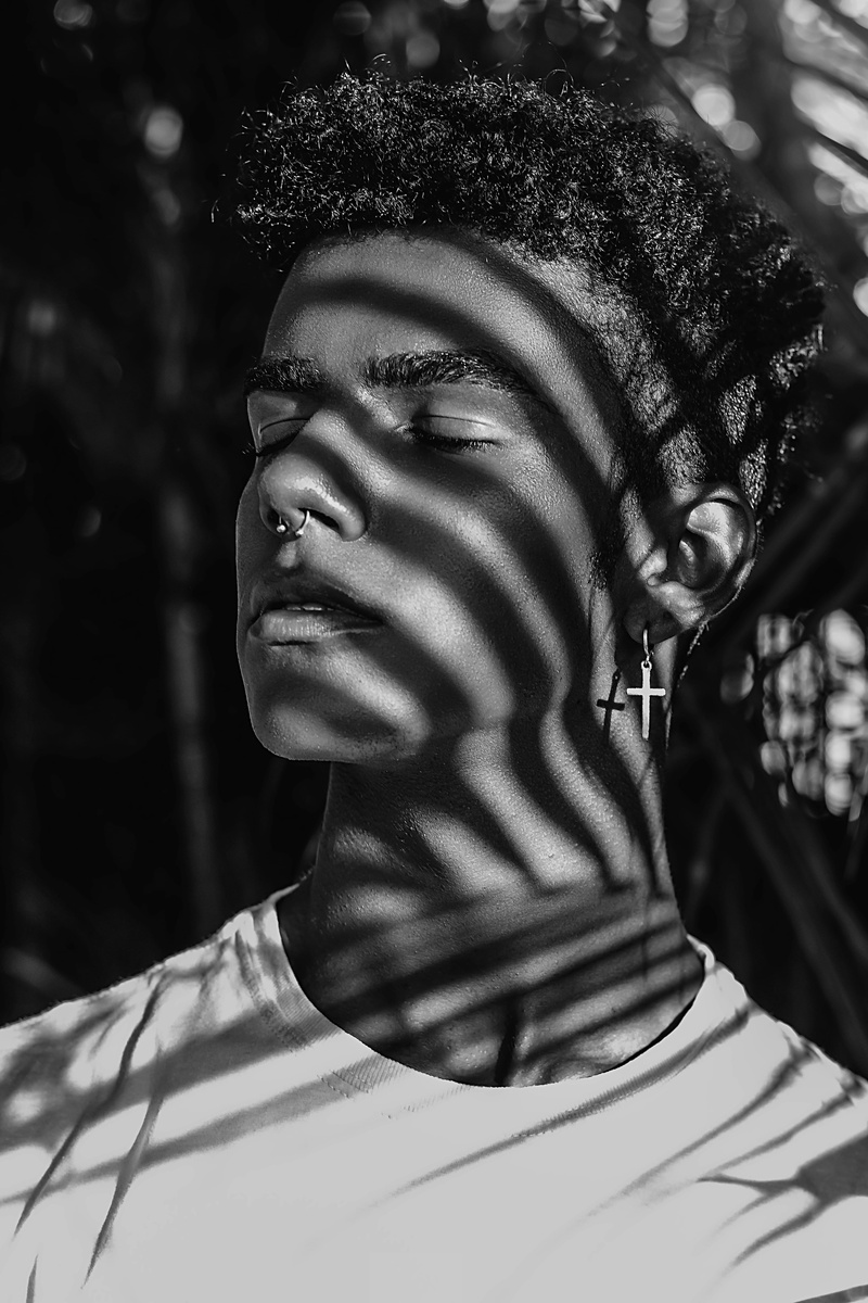 shadow, lifestyles, photo, leisure activity, monochrome, close-up, focus on foreground, earring, looking, attractive, headshot, young adult, one person
