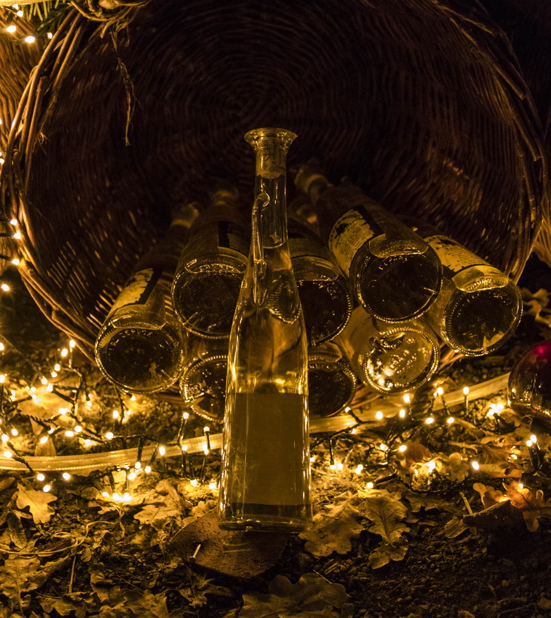 bottle, alcohol, christmas lights, glass - material, illuminated, glass bottles, ceiling, middle ages, close-up, low angle view, container, indoors, cold temperature