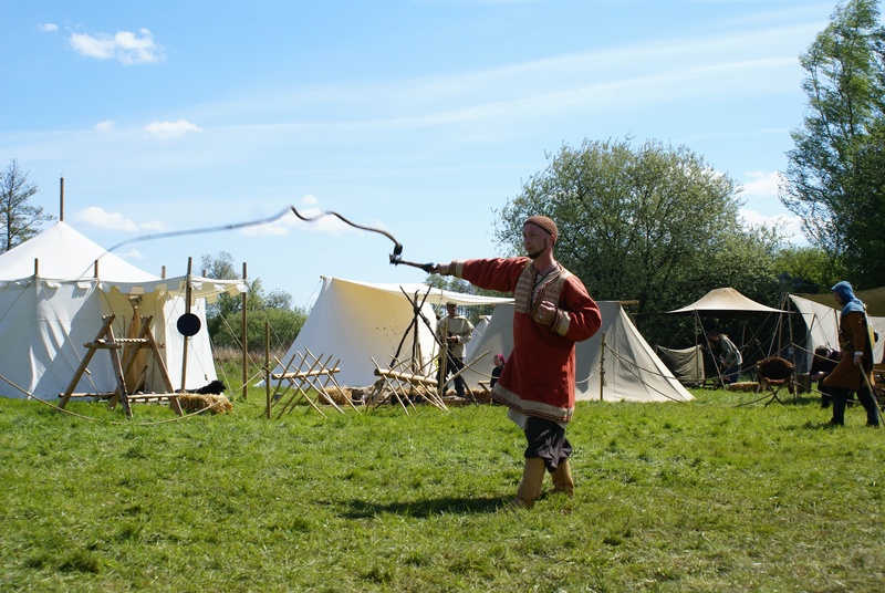 occupation, full length, nature, grass, medieval market, farmer, lifestyles, sky, casual clothing, tree, real people, working, whip, day, tents, cloud - sky