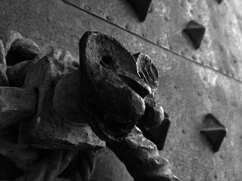 history, craft, outdoors, close-up, nature, focus on foreground, art and craft, sculpture, deterioration, black and white, forging, castle, day, human representation