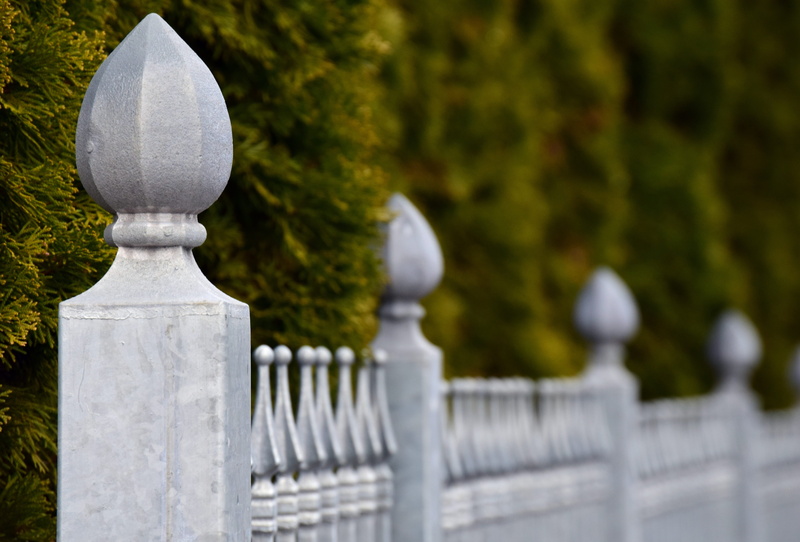 forged, outdoors, close-up, no people, railing, stone, boundary, balustrade, solid, demarcation, selective focus, blacksmithing, fencing, plot, nature