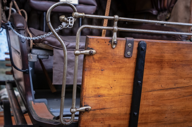 human body part, leather, clothing, transportation, brown, focus on foreground, vehicle, bike, travel, safety, security, chain, wood, tire, metal, vise