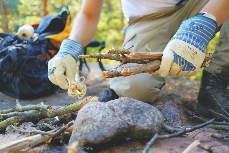 bushcraft, camping, person, holding, camp, start fire, path finder, focus on foreground, solid, men, lifestyles, outdoor, wilderness, stock, 4K, adventure