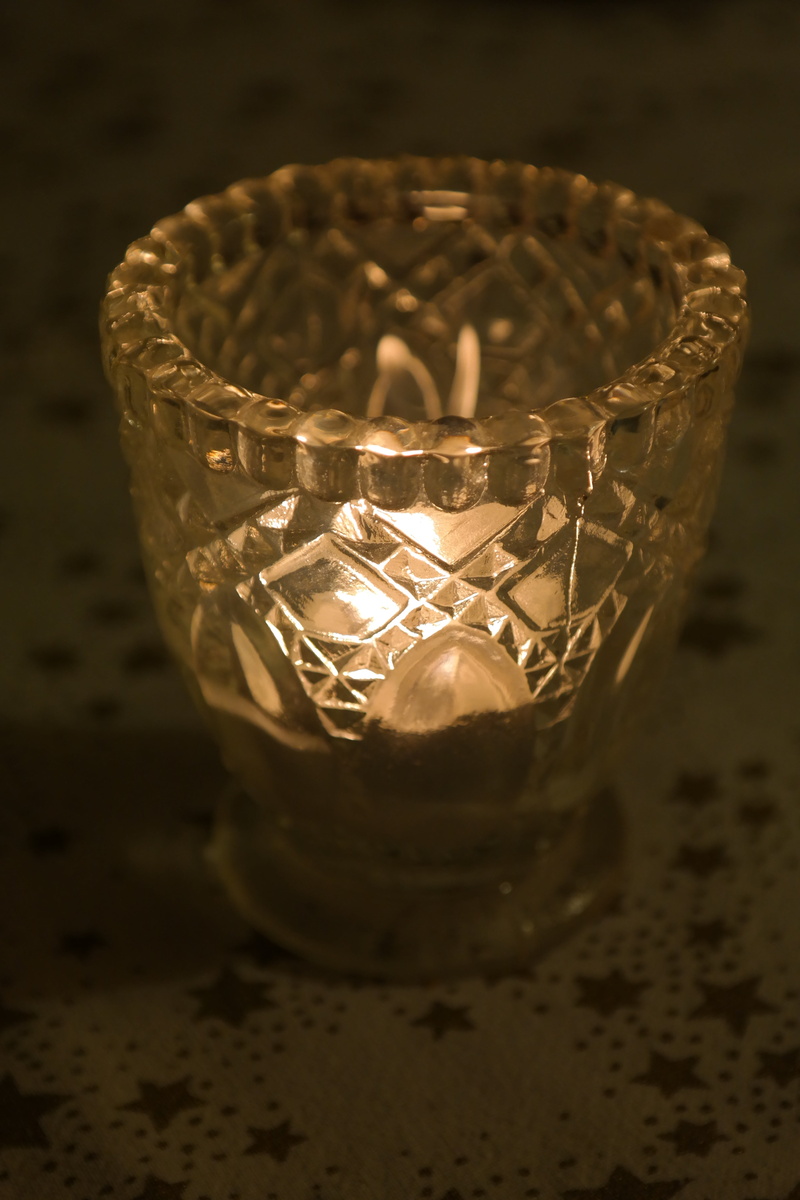 table, illuminated, high angle view, glass, transparent, tealight, selective focus, lighting equipment, dark, windlight, container, burn, close-up, light