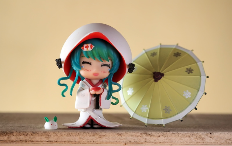 front view, childhood, outdoors, cute, anime, male likeness, television, toy, day, girl, miku, fun, creativity, studio shot, young, kimono, wall - building feature