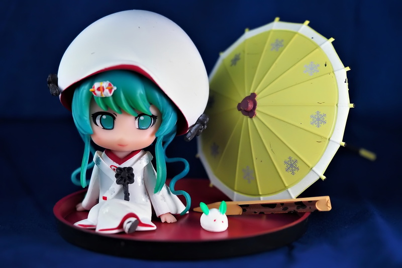 anime, colored background, series, cute, clothing, 4K, representation, small, male likeness, headwear, tv, studio shot, human representation, table, character