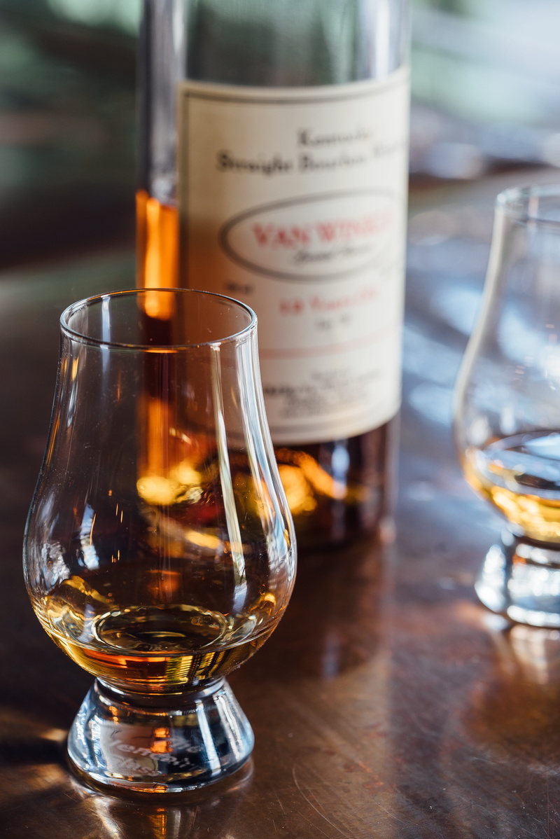 focus on foreground, pappy van winkle, household equipment, bourbon, indoors, bottle, food and drink, van winkle, drinking glass, no people, whiskey, beer glass