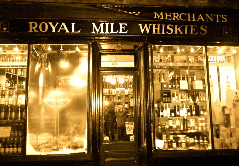 city, street, information, shop, outdoors, night, edinburgh, building exterior, western script, text, communication, store, illuminated, glass - material