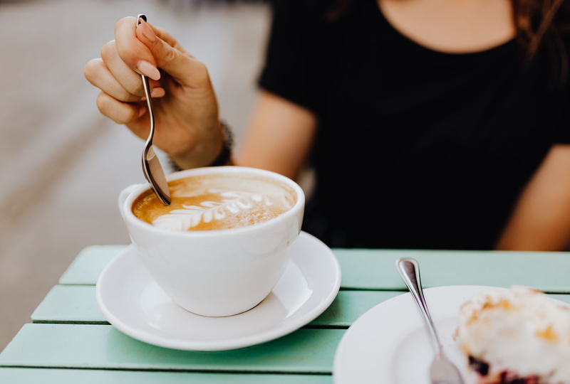 focus on foreground, female, mug, retaurant, coffee cup, holding, lunch, temptation, cafe, eating utensil, adult, crockery, cafeteria, kitchen utensil