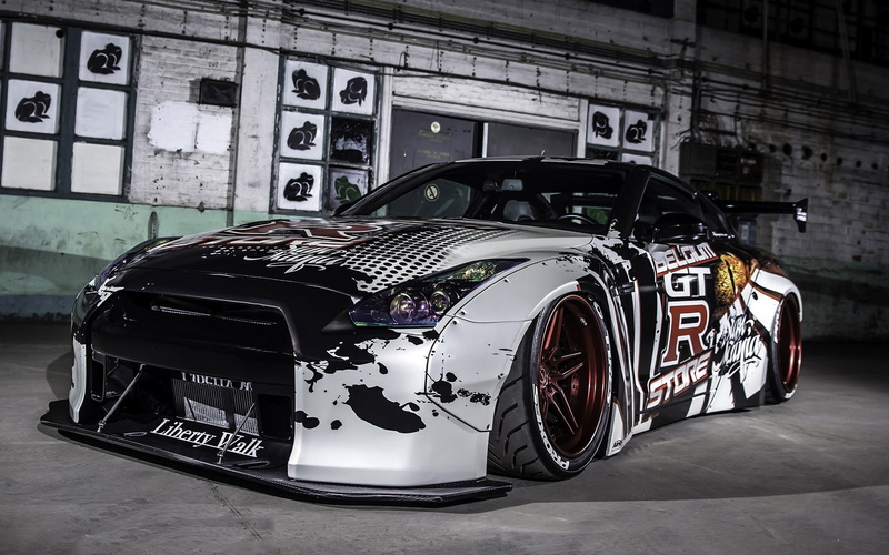 built structure, transportation, luxury, sports car, Datsun, white cars, wealth, no people, indoors, day, mode of transportation, stationary, land vehicle