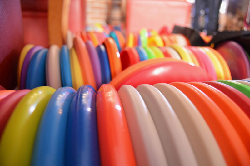 store, coathanger, disc, hanging, no people, indoors, large group of objects, shopping, choice, business, consumerism, order, retail, multi colored, variation