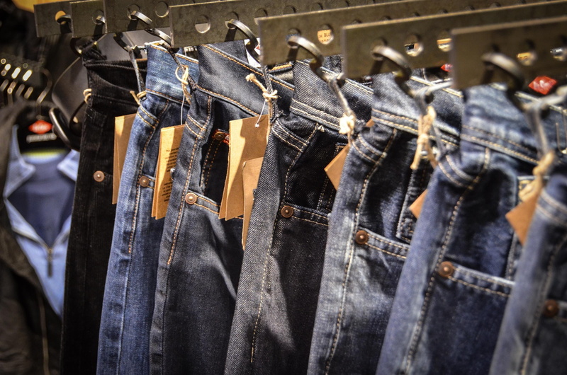 store, pants, no people, choice, coathanger, business, jeans, hanging, metal, fashion, blue, large group of objects, clothing, clothes, shelf, arrangement