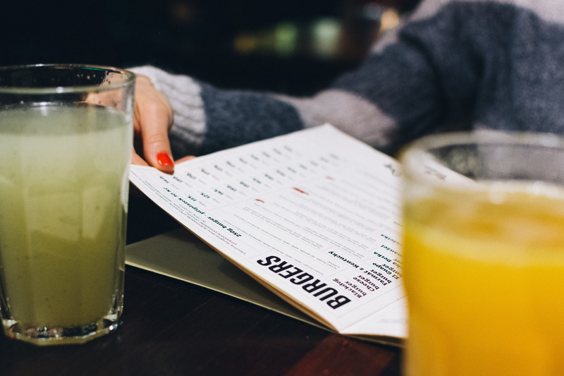 hands, household equipment, food, freshness, one Person, drink, drinking Glass, juice, restaurant, close-up, food and drink, indoors, human body part, menu