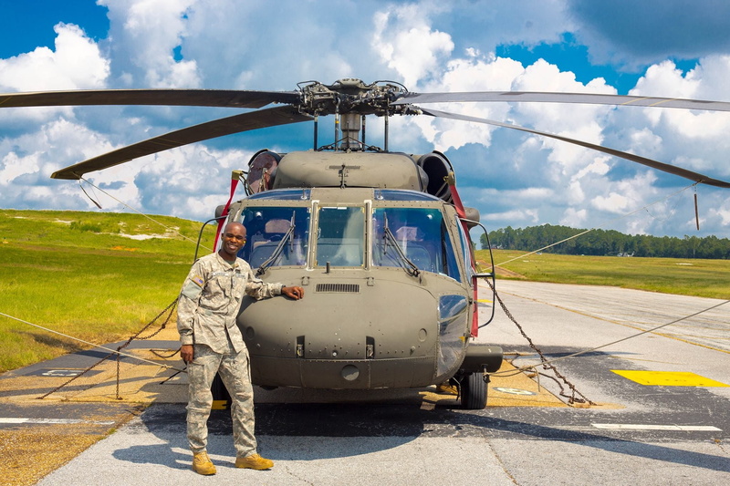 outdoors, aircraft, two people, army, black hawk, air vehicle, day, uniform, 1080P, aerospace industry, african american, airport runway, occupation, transportation