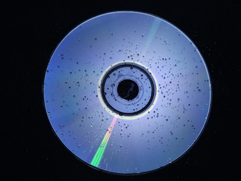 close-up, domestic room, dvd, wet, backgrounds, directly above, silver, blue, drop, shape, kitchen, technology, circle, directly below, nature, cd, indoors