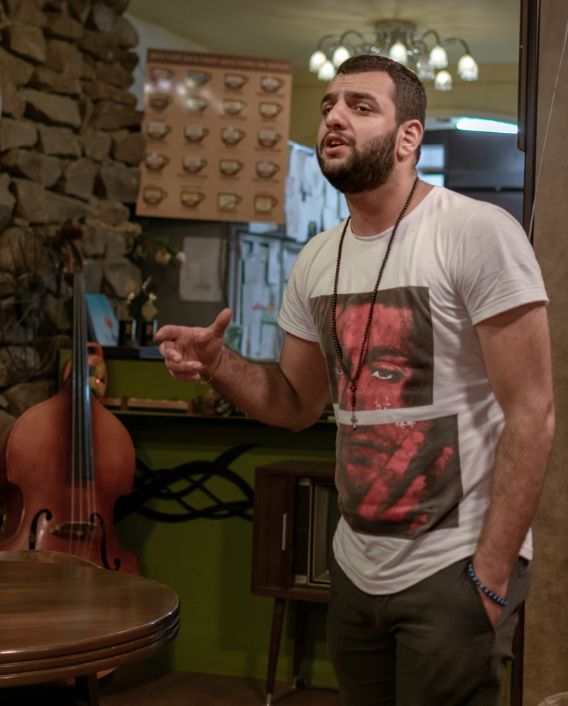 arts culture and entertainment, front view, vocalist, business, real people, qaf café, musical instrument, singer, musical equipment, ahvaz, iranian, standing