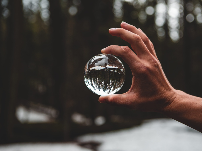 money, human hand, one person, close-up, holding, human limb, outdoors, contact lens, coin, leisure activity, finger, human body part, reflections, reflection