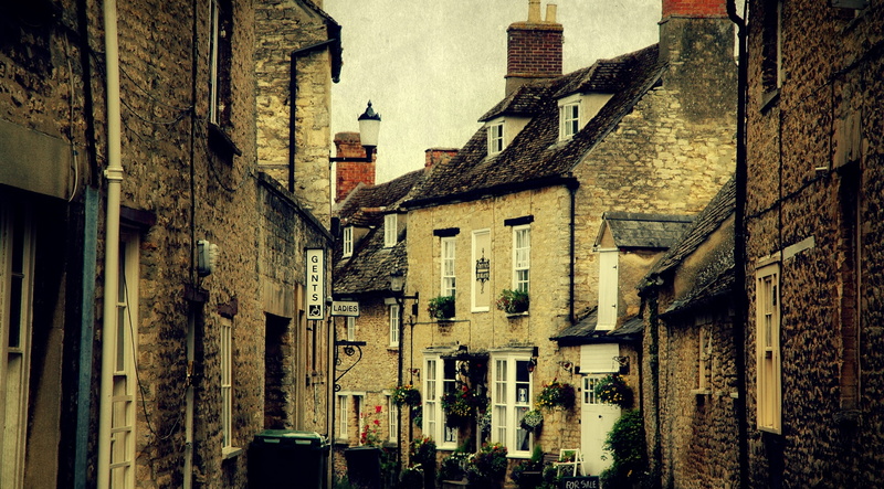 building, woodstock, window, architecture, wall - building feature, the past, alley, weathered, outdoors, communication, built structure, storey, low angle view