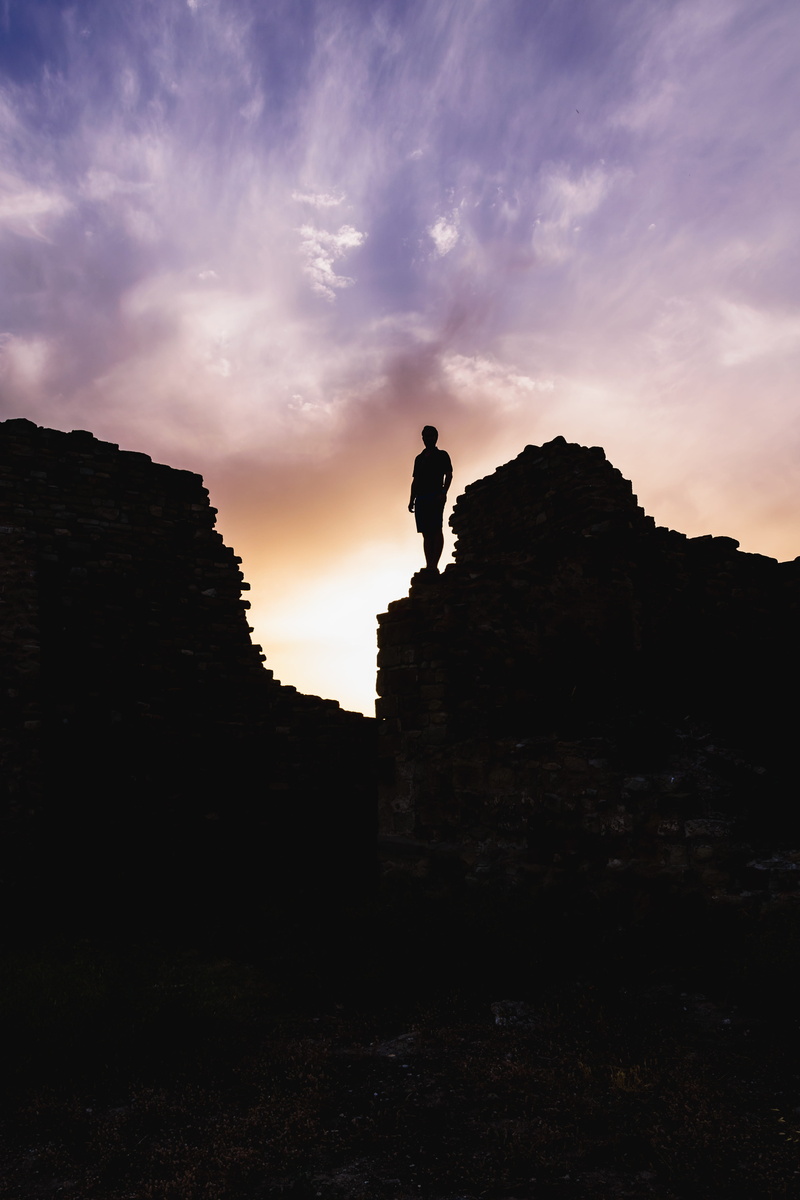 outdoors, italy, formation, low angle view, silhouette, sardinia, standing, standing on rock, scenics - nature, pink sky, man, gargoyle, sunset, beauty in nature