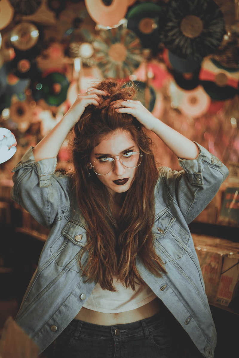 glasses, blue, wavy hair, front view, white, denim, teenager, female, indoors, lifestyles, hairstyle, hair, caucasian, beauty, one person, arms raised