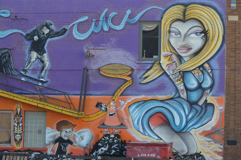 Street Art, architecture, low angle view, artwork, graffiti art, male likeness, built structure, culture, colorful, urban, wall, vandalism, craft, day