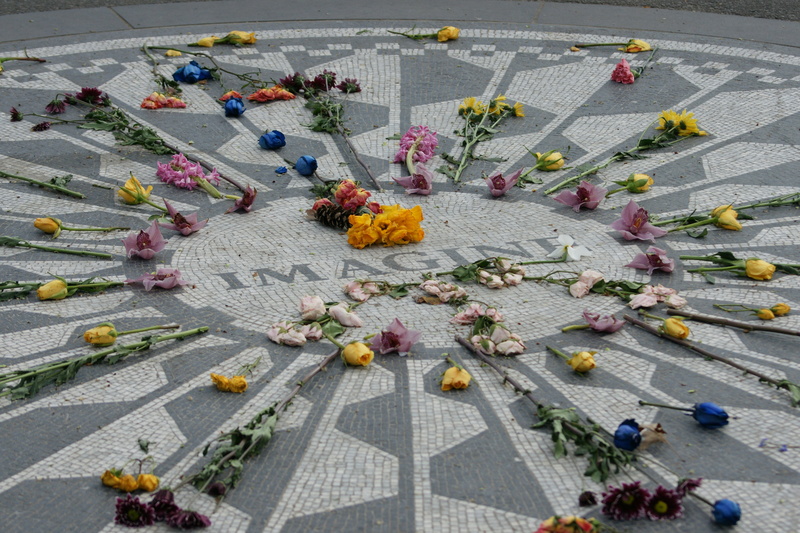 day, flowering plant, outdoors, flower arrangement, adult, built structure, street, group of people, crowd, john lennon, high angle view, women, nature
