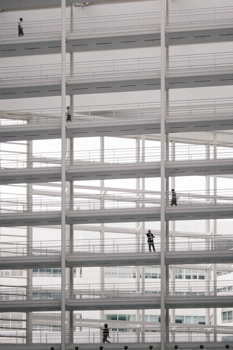 grid, full length, walking, window, glass - material, people, monochrome, frame, black and white, inside, architecture, group, men, walk, office building exterior